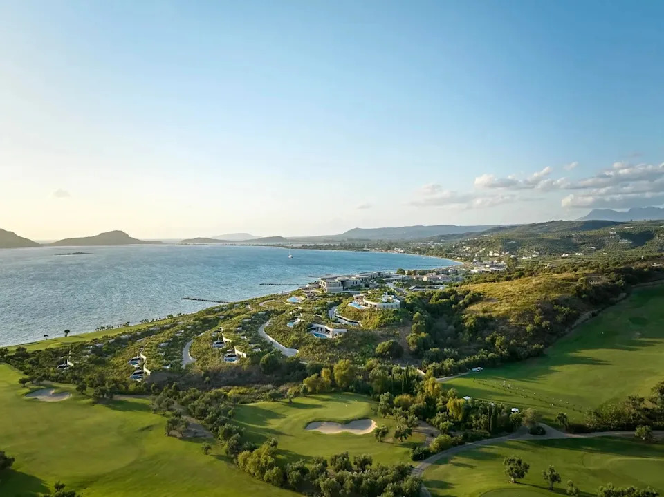 Mandarin Oriental Costa Navarino luxury resort cascading down the hillside with panoramic views of the Ionian Sea in Greece.