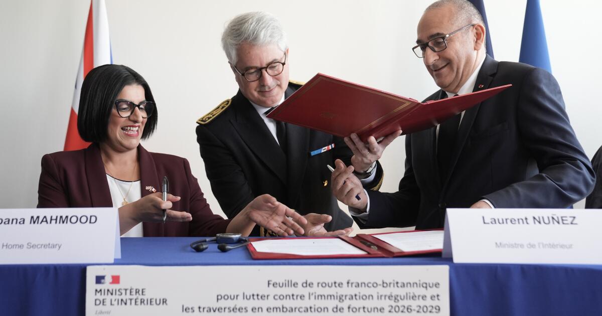 U.K. and French governments sign a 3-year deal to curb migrant crossings in English Channel