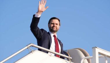 The US vice president waves before stepping into Air Force Two