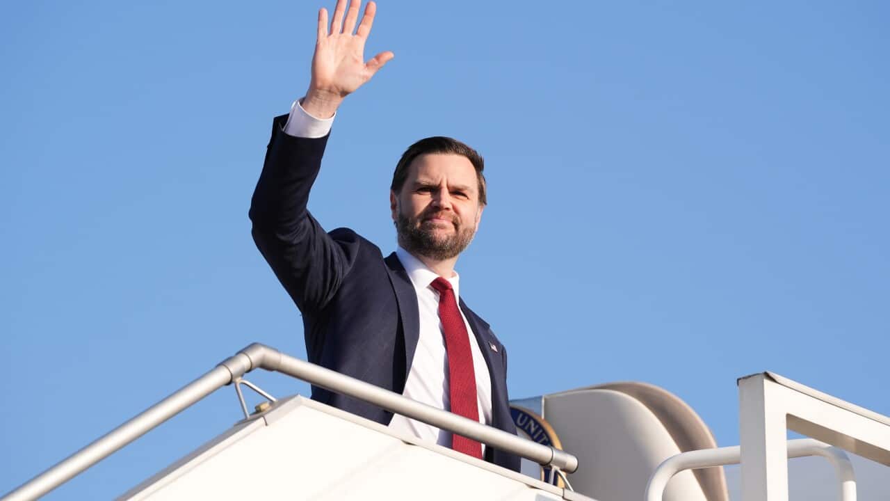 The US vice president waves before stepping into Air Force Two