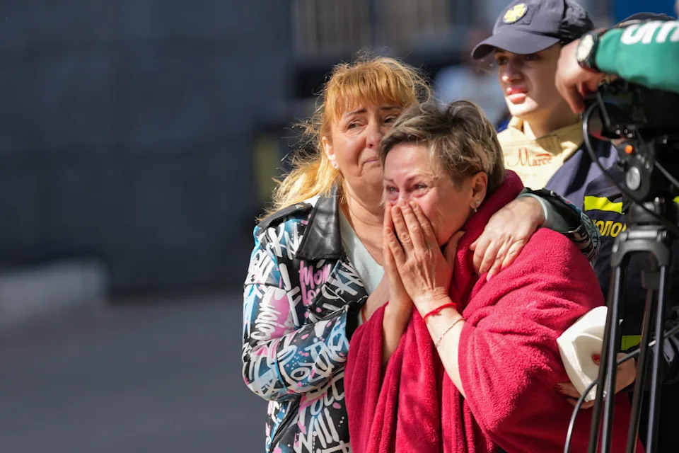 People comfort a crying woman on May 14, 2026 in Kyiv, Ukraine.  / Credit: Ivan Antypenko/Global Images Ukraine via Getty Images