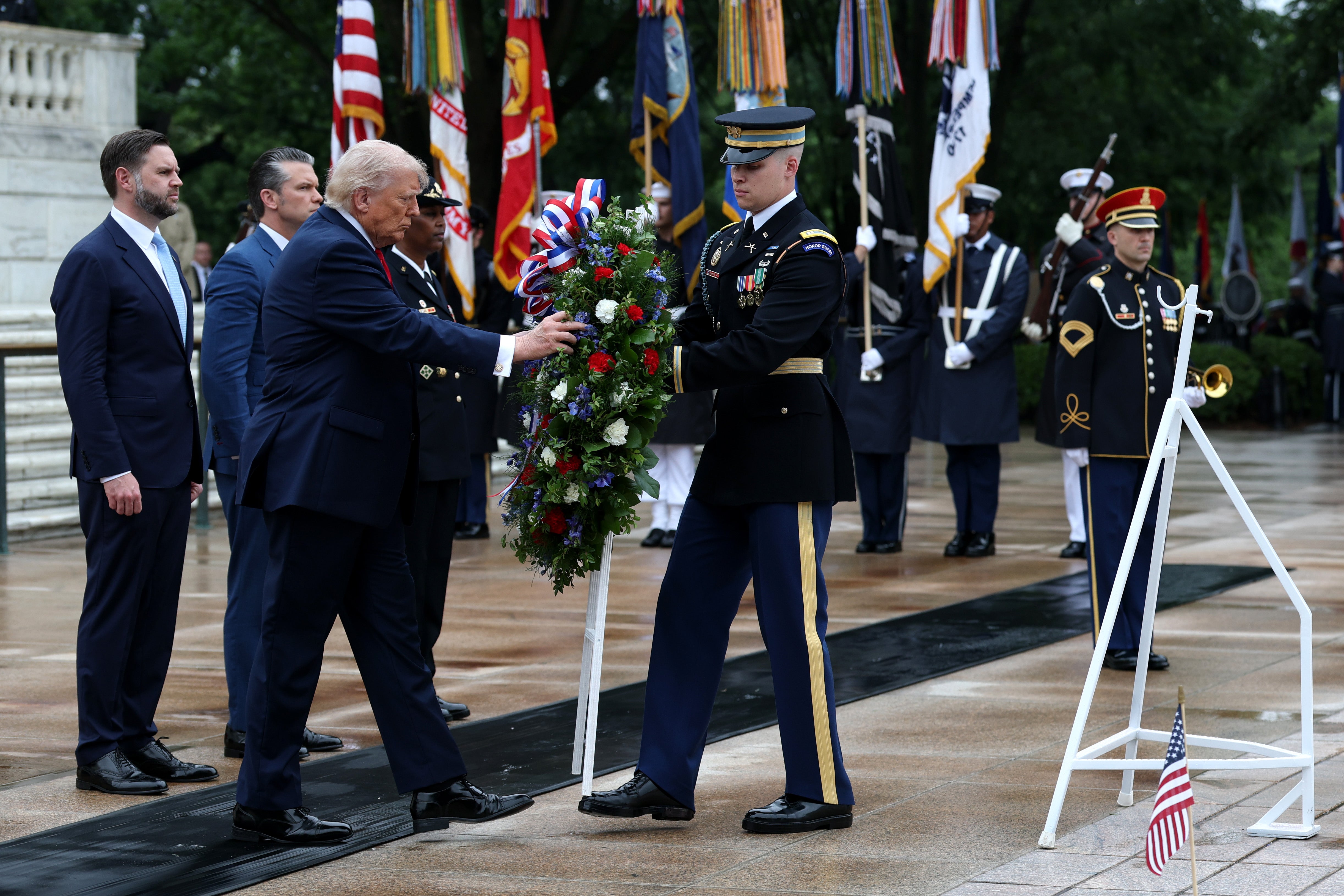The president participated in a wreath-laying at Arlington to commemorate fallen soldiers before addressing a crowd at the event