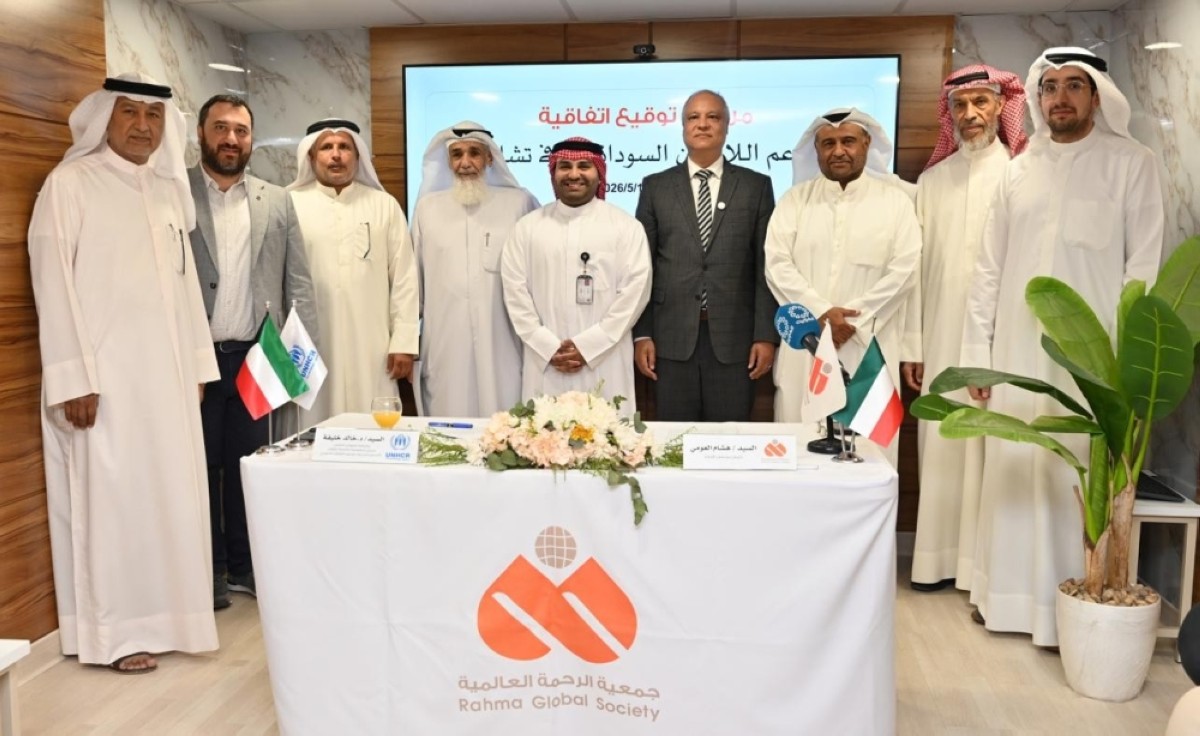 Khaled Khalifa and Hisham Al-Oumi pose for a group photo. - Photos by Yasser Al-Zayyat
