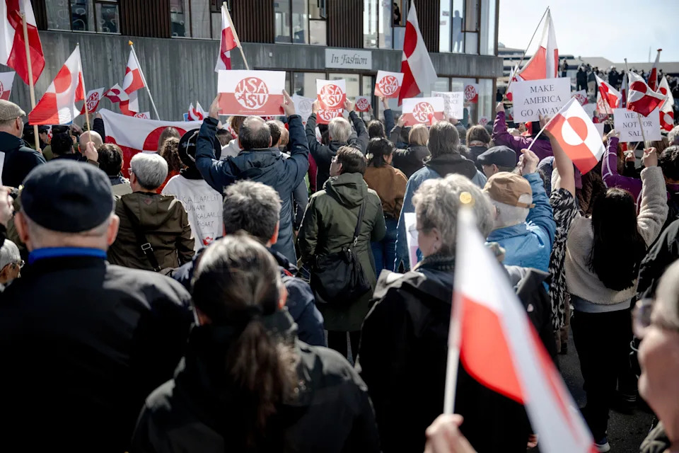 People turn their backs against the new U.S. consulate, during a protest in Nuuk, Greenland, on May 21. (Oscar Scott Carl/Ritzau Scanpix via AP)