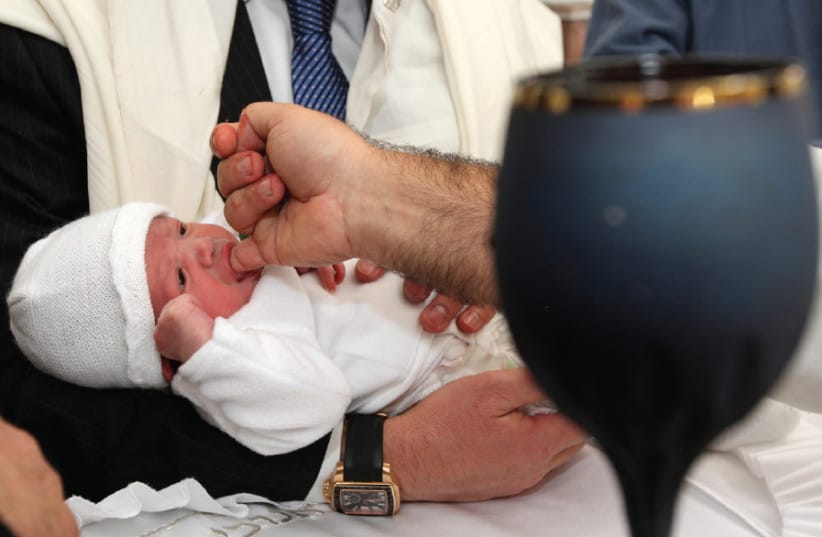 A ritual circumcision being performed according to Jewish tradition. Ilustrative.