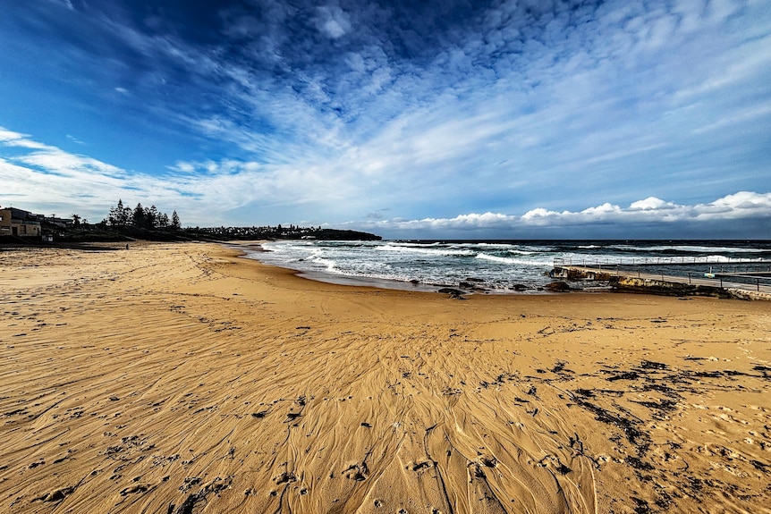 Channels on the sand at Sydney's Curl Curl Beach after days of rain