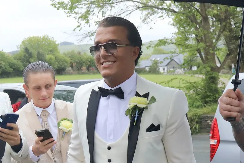 Groom Noah was all smiles as he made his way to his wedding