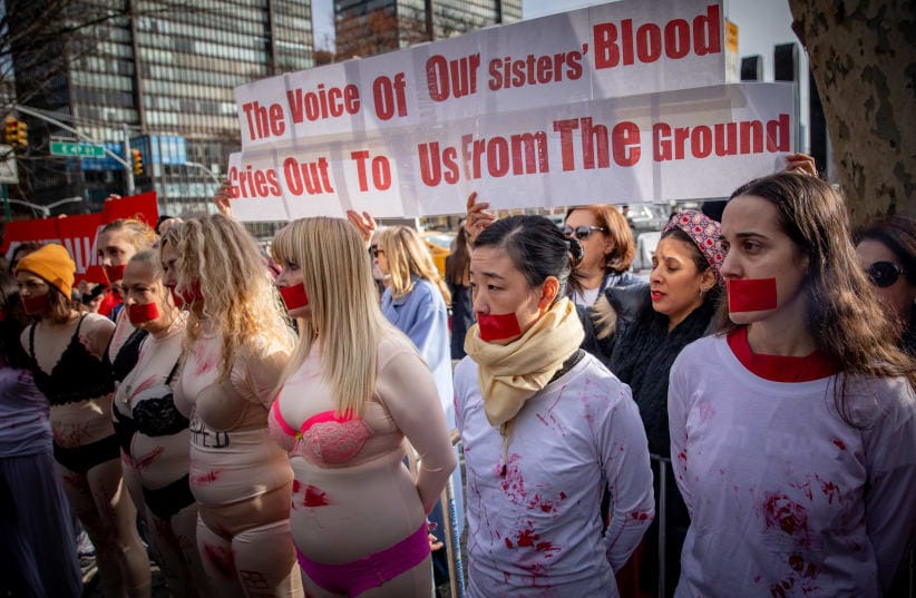  Demonstrators gather during a protest the crimes and sexual violence against women in October 7 massacre, outside of United Nations headquarters in New York City, on December 4, 2023. 