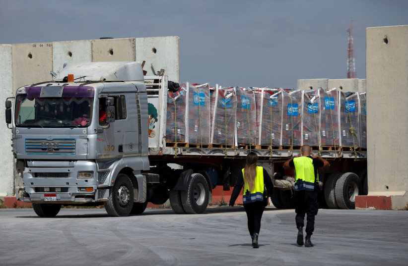 A truck carrying humanitarian aid bound for the Gaza Strip drives at the inspection area at the Kerem Shalom crossing, amid the ongoing conflict between Israel and the Palestinian Islamist group Hamas, in southern Israel, March 14, 2024.