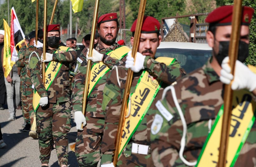 Members of the Iran-backed Iraqi militias al-Nujaba and Kataib Hezbollah appear in Baghdad on December 4, 2023.