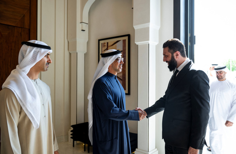 UAE's Vice President and Deputy Prime Minister Sheikh Mansour bin Zayed Al Nahyan greets Syria's President Ahmed al-Sharaa, as UAE's Deputy Chairman of the Presidential Court for Special Affairs Sheikh Hamdan bin Mohamed bin Zayed Al Nahyan looks on, at Al Shati Palace, in Abu Dhabi.
