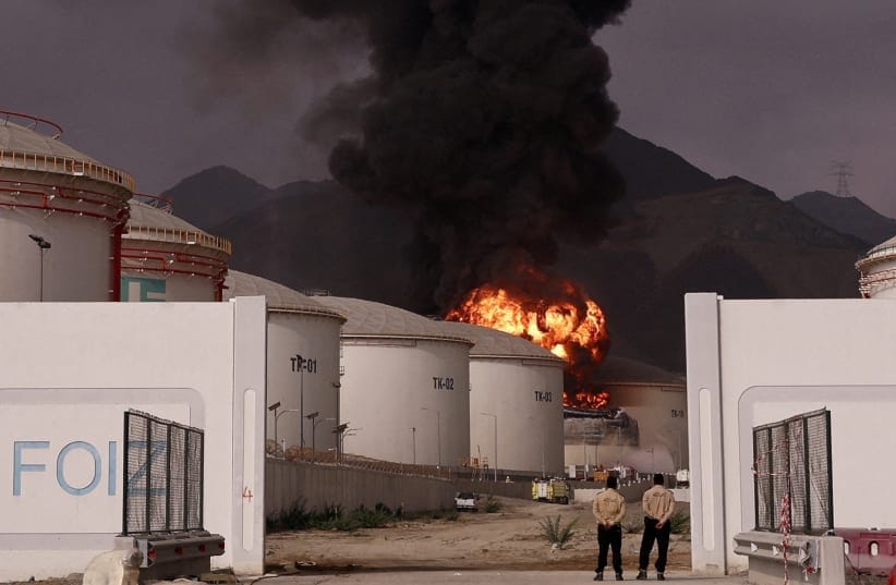 Fire and smoke rise in the Fujairah Oil Industry Zone, caused by debris after interception of a drone by air defenses, UAE, March 4, 2026; illustrative.
