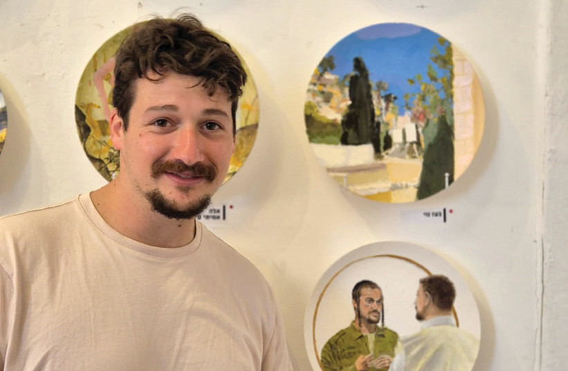 Avi Miller, a former lone soldier recently returned from reserves, with his piece ‘The King’s Son and I,’ at Tel Aviv’s Uri Lifshitz Studio.