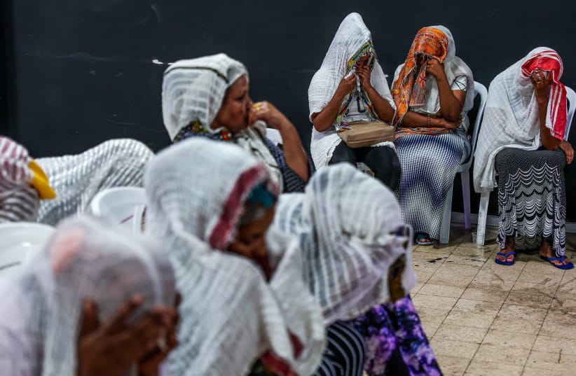 Eritrean asylum seekers mourn after a member of their community was killed last night in riots between Eritrean asylum seekers who oppose the regime in Eritrea and pro regime activists in Tel Aviv, May 28, 2024; illustrative.