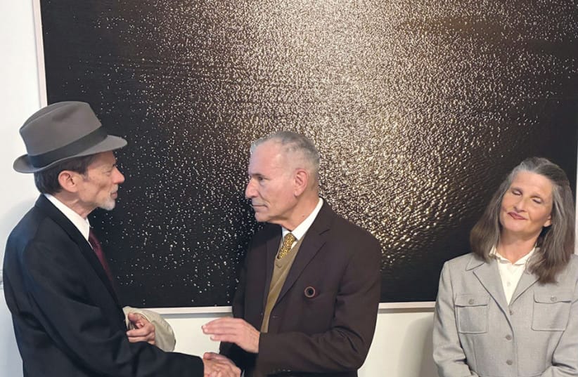 Heisenberg, played by David Golinkin (L), is greeted by Niels Bohr, played by Yehoshua Looks, with Bohr’s wife, Margarethe, played by Miriam Metzinger.