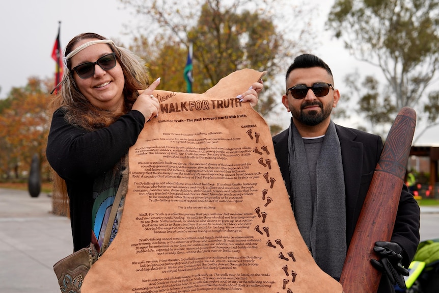 two pariticipants holding hte kangaroo cloak message