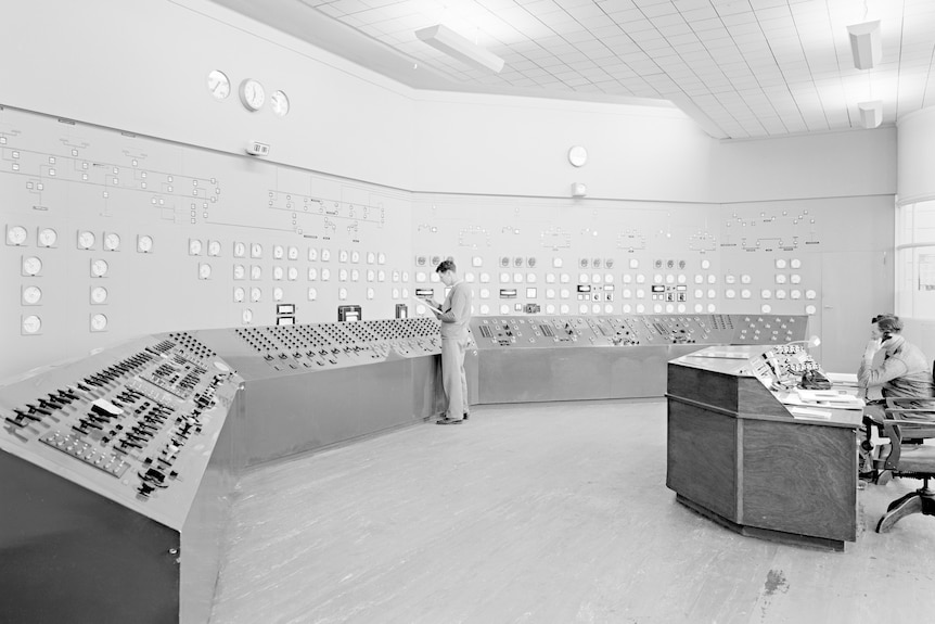 Technicians work at the control panel of the Playford power station.