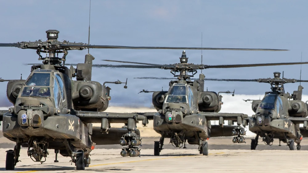 Army AH-64 Apache attack helicopters taxi out to conduct a scheduled flight in the U.S. Central Command area of responsibility while supporting “Operation Epic Fury,” May 1, 2026.