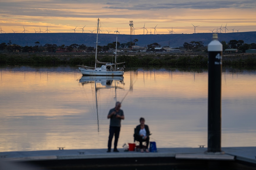 A view of a boat and wind turbines in the vicinity of Port Augusta in SA.