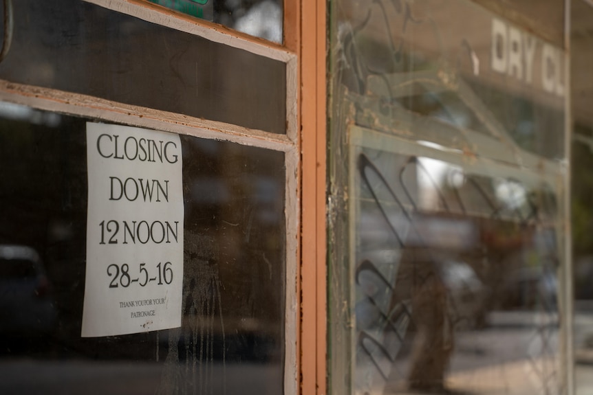 A sign which reads closing down on May 28 2016 and remains in a window in Port Augusta in SA.