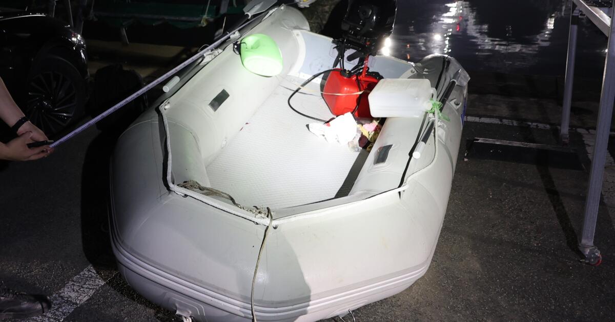 A Chinese dissident is in South Korean custody after a perilous escape by rubber boat