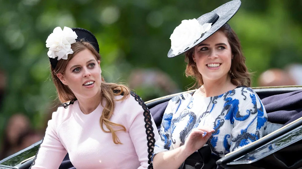 Pricess Beatrice and Princess Eugenie riding in a carriage