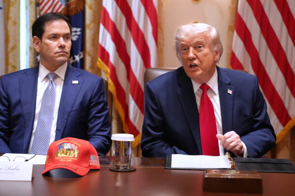 President Donald Trump, next to Secretary of State Marco Rubio, speaks during a Cabinet meeting at the White House, Wednesday, May 27, 2026, in Washington. (AP Photo/Jacquelyn Martin)