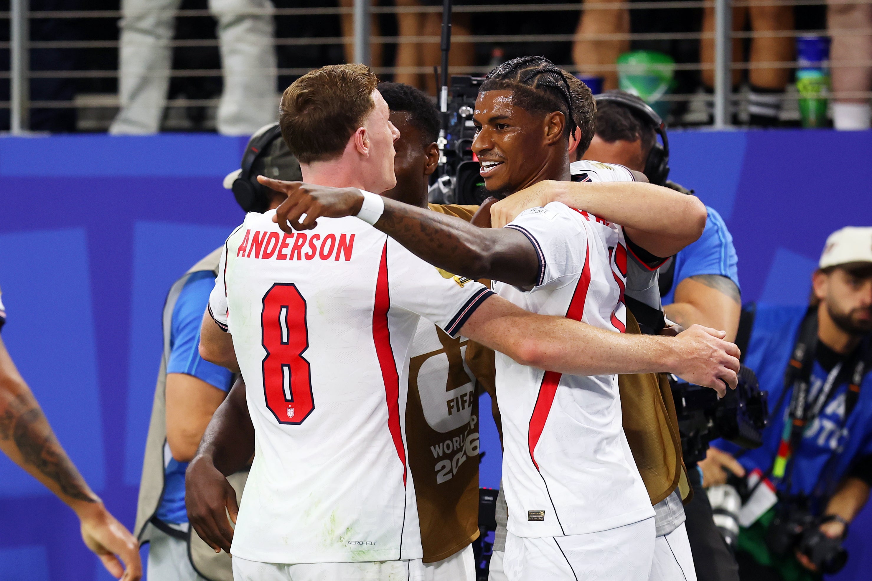 Marcus Rashford #11 of England celebrates with teammate Elliot Anderson #8 after scoring his team's fourth goal