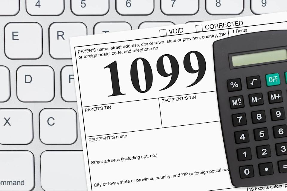 Doing your taxes as a freelancer with a USA 1099 form on a keyboard
