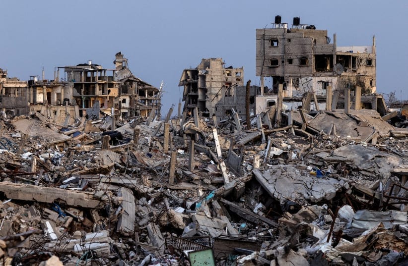 Buildings lie in ruins amid the rubble in Rafah in the southern Gaza Strip, December 8, 2025. 