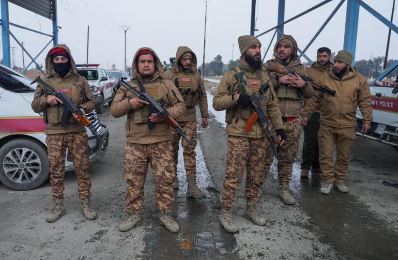 Members of the Syrian military police gather outside al-Aqtan prison, where some Islamic State detainees are held, in Raqqa, Syria January 22, 2026.