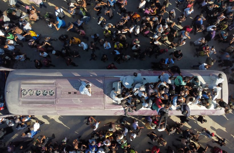 A drone view shows people gathering at Nasser hospital as they welcome freed Palestinian prisoners released by Israel as part of a hostages-prisoners swap and a ceasefire deal between Hamas and Israel, in Khan Younis in the southern Gaza Strip, October 13, 2025.