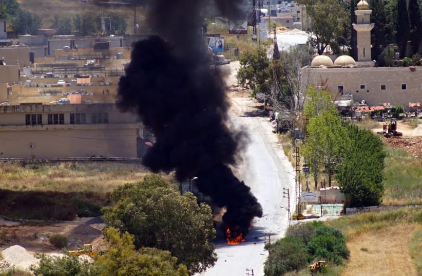 Smoke rises from a vehicle targeted by an Israeli drone attack in the southern Lebanese city of Nabatieh on June 5, 2026.