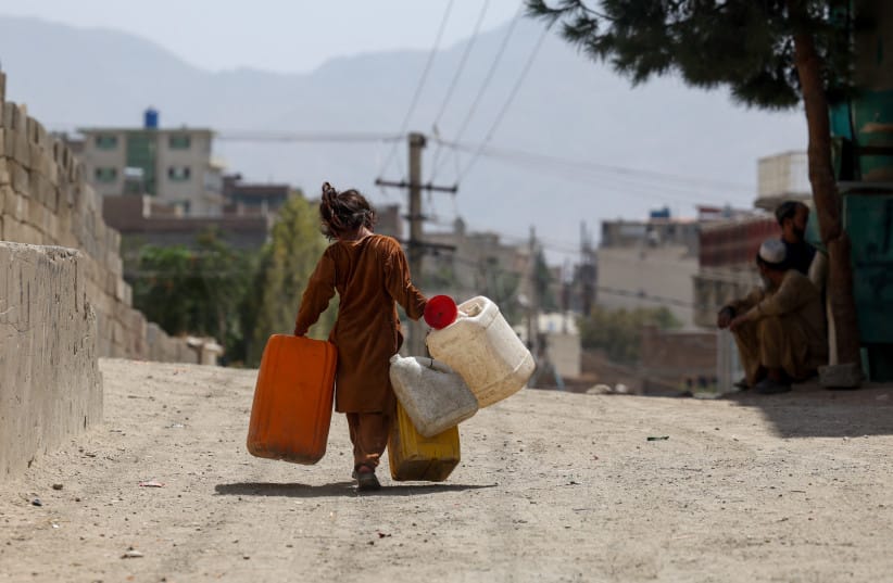 A GIRL carries empty barrels to fetch water, amid serious water crisis in Kabul, Afghanistan, August 28, 2025.