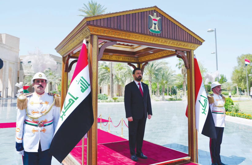 IRAQ’S NEW PRIME MINISTER Ali al-Zaidi stands during the official handover ceremony in Baghdad, May 16.