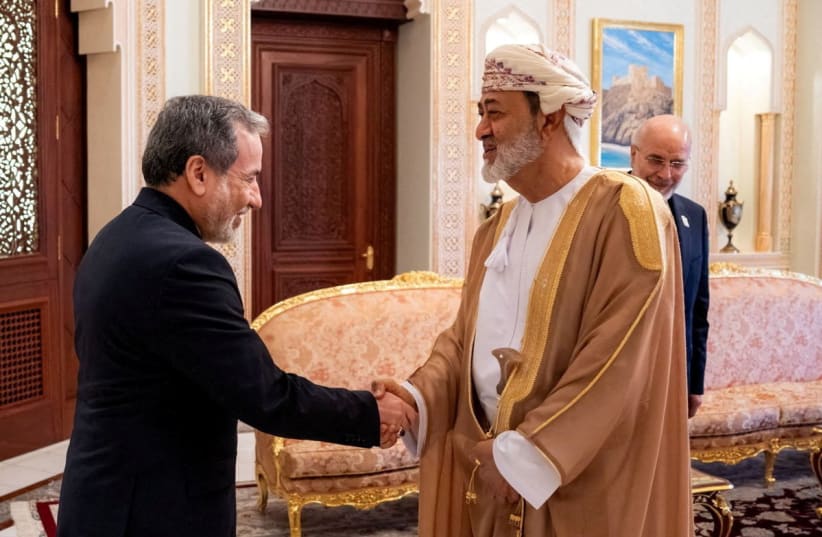 Iranian Foreign Minister Abbas Araqchi shakes hands with Sultan of Oman Haitham bin Tariq Al Said in Muscat, Oman, June 23, 2026.