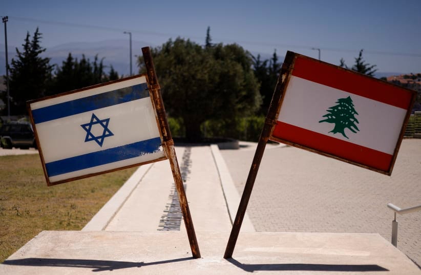 Israeli and Lebanese flags are pictured at a monument called the "Good Fence" in the northern town of Metula bordering Lebanon on June 18, 2026. 