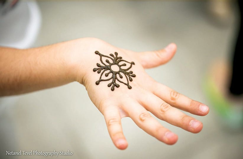 Enjoy temporary henna tattoos.