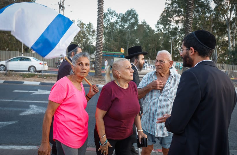 RESIDENTS OF Kfar Yona protest against an ultra-Orthodox demonstration opposing the arrest of Haredi draft evaders near the Beit Lid military prison in central Israel, June 24, 2026.