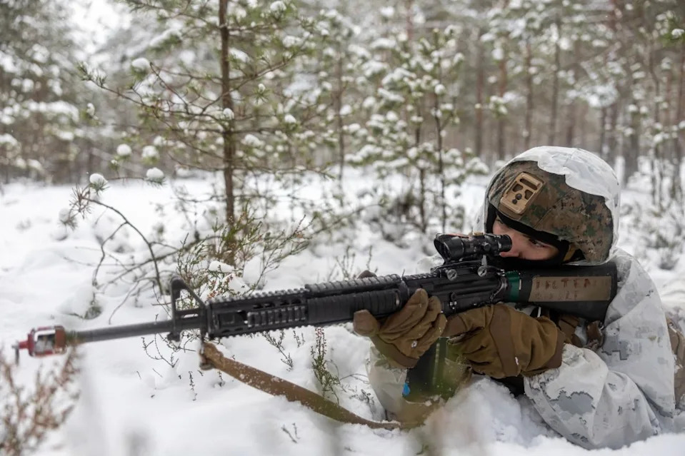 U.S. Marine Corps Lance Cpl. Thomas Teague, a motor vehicle operator assigned to Combat Logistics Battalion 6, Combat Logistics Regiment 2, 2nd Marine Logistics Group, provides security for a convoy during offensive and defensive operations in Syndalen, Finland during exercise Freezing Winds 23 (FW23), Nov. 30, 2023. FW23 is a Finnish-led maritime exercise in which United States Marines assigned to Marine Rotational Force- Europe, and U.S. Navy Forces Europe take part; the exercise serves as a venue to increase Finnish Navy readiness, increase U.S., Finland, and NATO partners' interoperability in operational logistics, integrated fires, and amphibious operations within the Baltic Sea littorals. (U.S. Marine Corps photo by Lance Cpl. Christian Salazar)