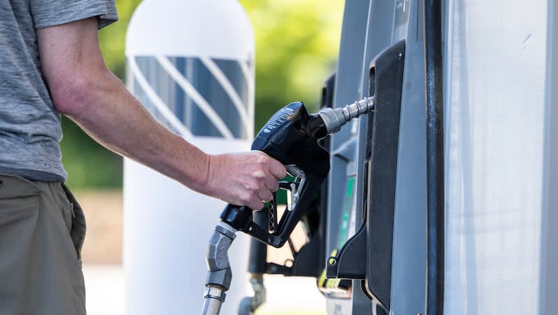 A customer fills up their car at the Foothill Drive Chevron in Salt Lake City on Monday, June 15, 2026.