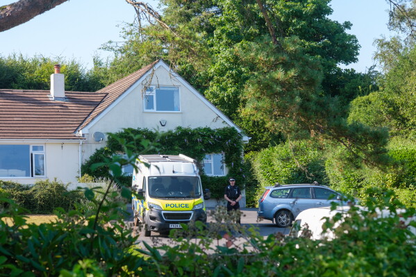 Police outside the house of former lawmaker Ann Widdecombe, in Haytor, England, Friday July 10, 2026, after she was found dead in her home on Thursday with serious injuries. (Matt Keeble/PA via AP)