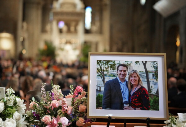 Pictures of Mark and Melissa Hortman are set up inside the sanctuary at the Basilica of St. Mary's during funeral services for Mark and Melissa Hortman in Minneapolis, Saturday, June 28, 2025. (Alex Kormann/Star Tribune via AP, Pool, File)