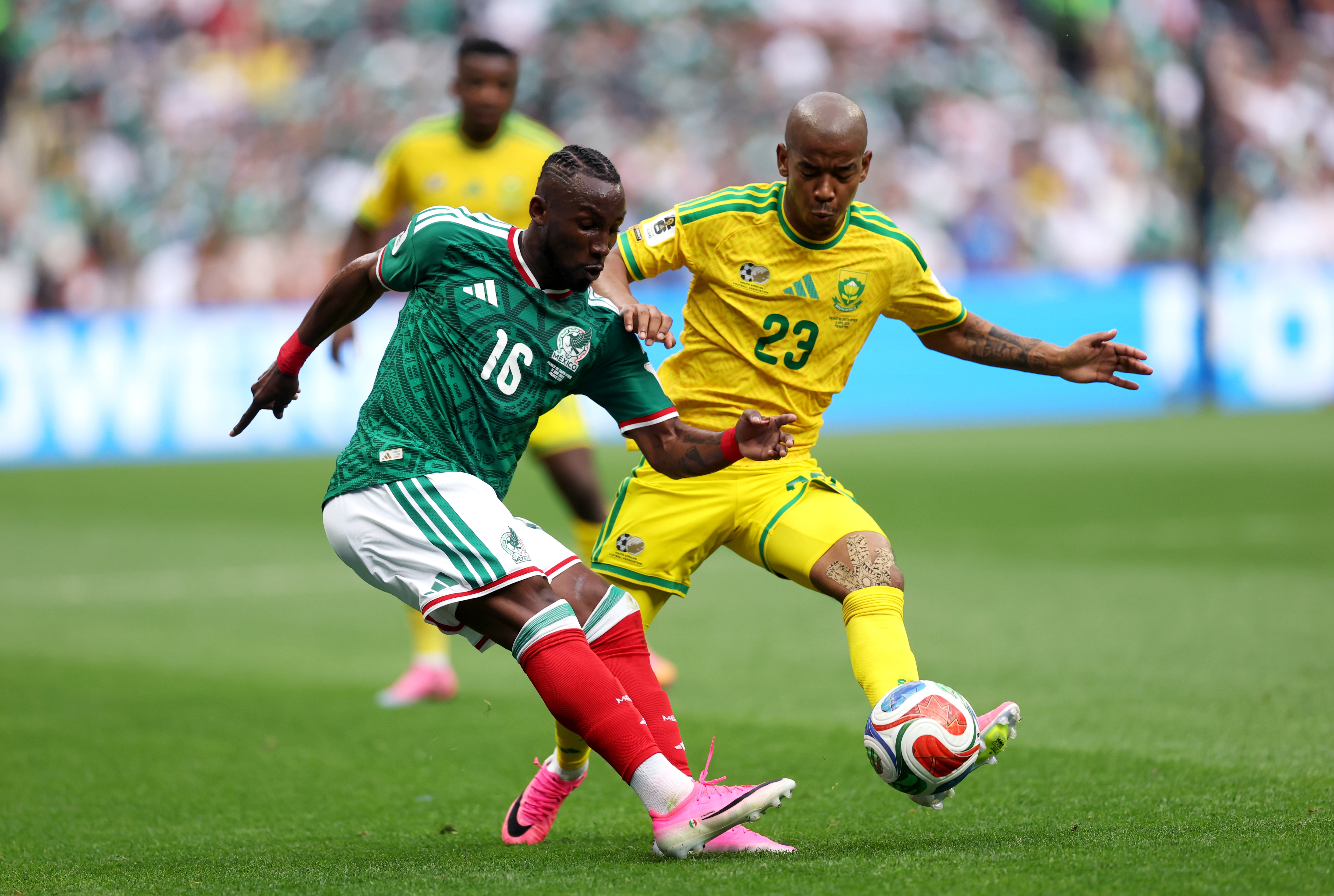 Julian Quinones of Mexico is challenged by Jayden Adams of South Africa