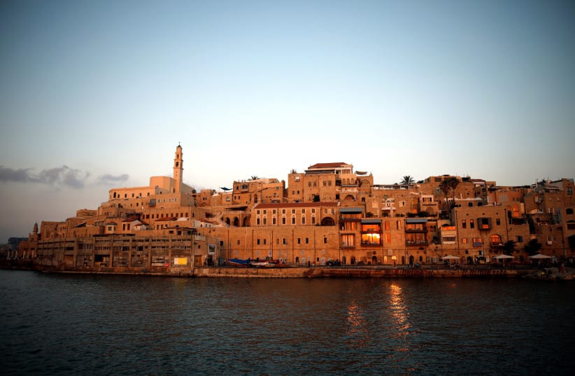 Lights are reflected in the Mediterranean Sea, as a view of Jaffa Port is seen at sunset, in Jaffa, Israel June 16, 2019. Picture taken June 16, 2019