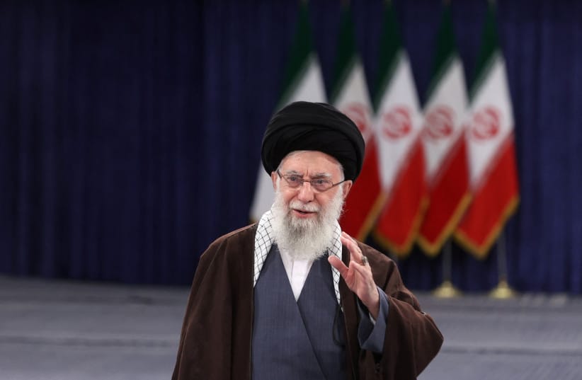 Iran's Supreme Leader Ayatollah Ali Khamenei gestures before he votes during parliamentary elections in Tehran, Iran, March 1, 2024.