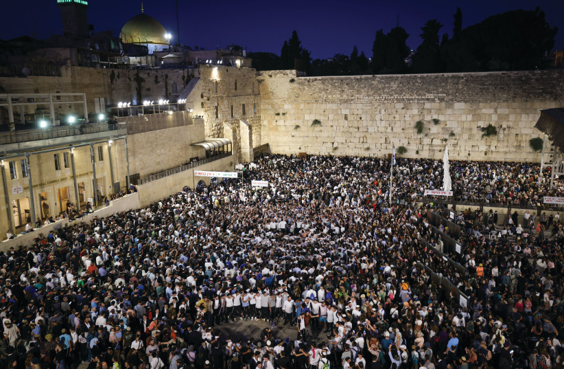 Worshipers are seen at the Western Wall in Jerusalem on Tisha B'Av.