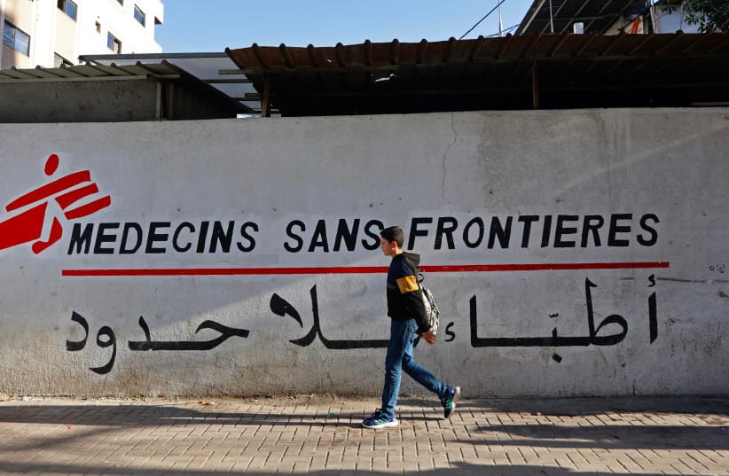 A Palestinian boy walks past the clinic of Doctors Without Borders or Medecins Sans Frontieres (MSF), in the al-Rimal neighborhood of Gaza City on January 11, 2026.