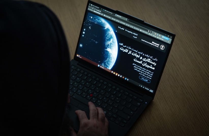An illustrative photo of a laptop displaying a website in Persian with references to Mossad, representing cyber or intelligence-related activity, March 27, 2026.