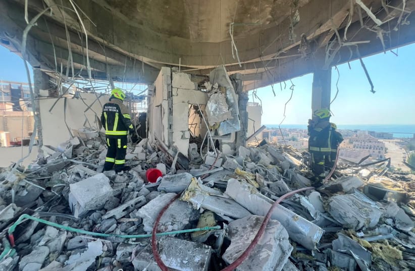 Bahrain civil defense and rescue personnel work in a residential building, which according to the Bahraini Interior Ministry, was hit by an Iranian drone, in Muharraq, Bahrain, June 28, 2026.